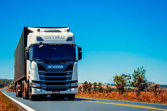 Heavy-duty semi truck rolling at golden hour