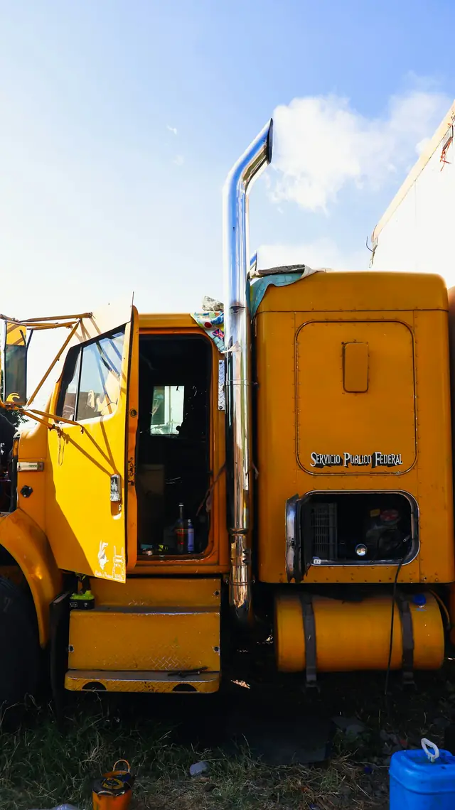 Mechanic working on a heavy-duty truck in the shop